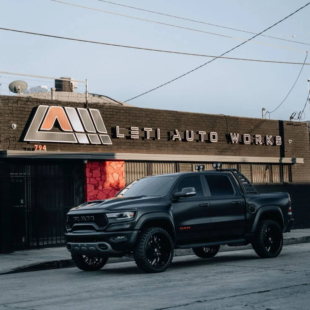 Leti Auto Works shop front at 794 Merchant St in the Arts District, with the illuminated sign above the gates